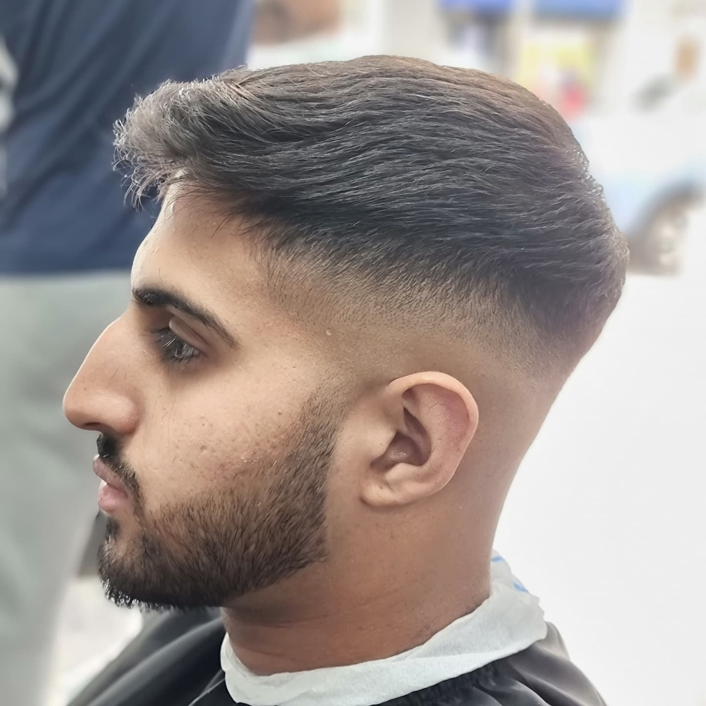 A finished short haircut and beard at The Unique Barbers
