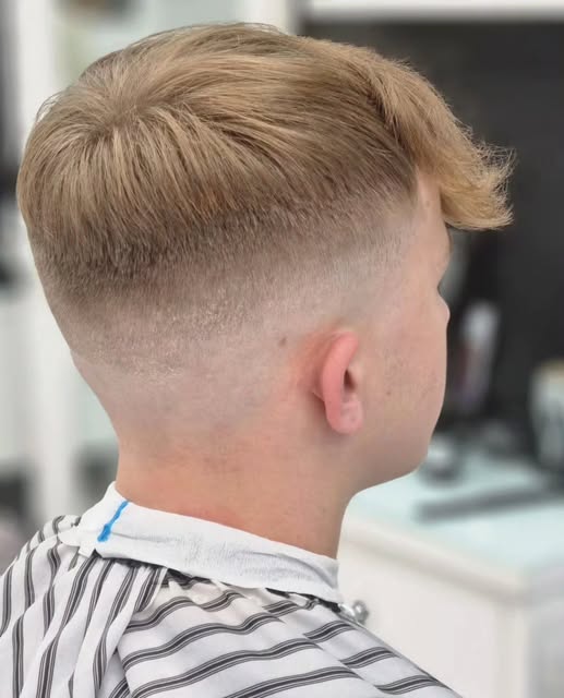 Finished haircut with a blended short back and sides